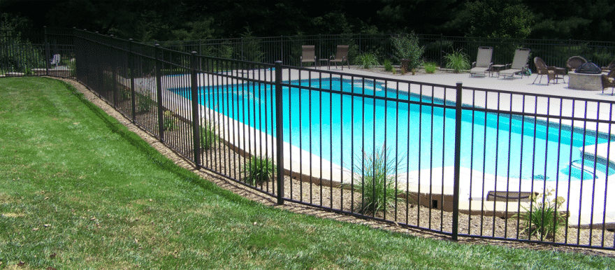 Blogs 18 Technicians installing aluminum pool fence panels at a residential backyard